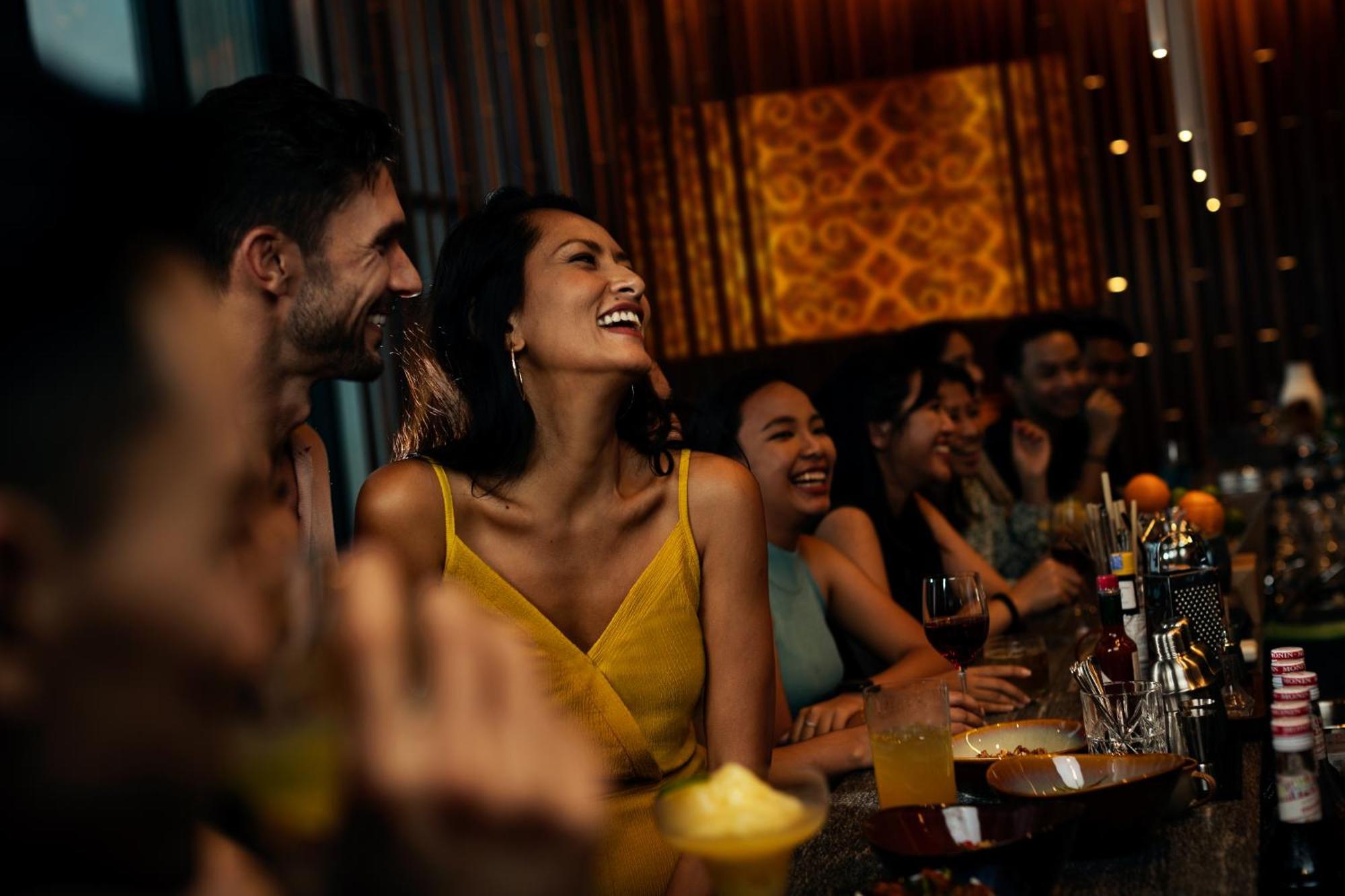 Hyatt Centric Kota Kinabalu Hotel Exterior foto A woman laughing with friends